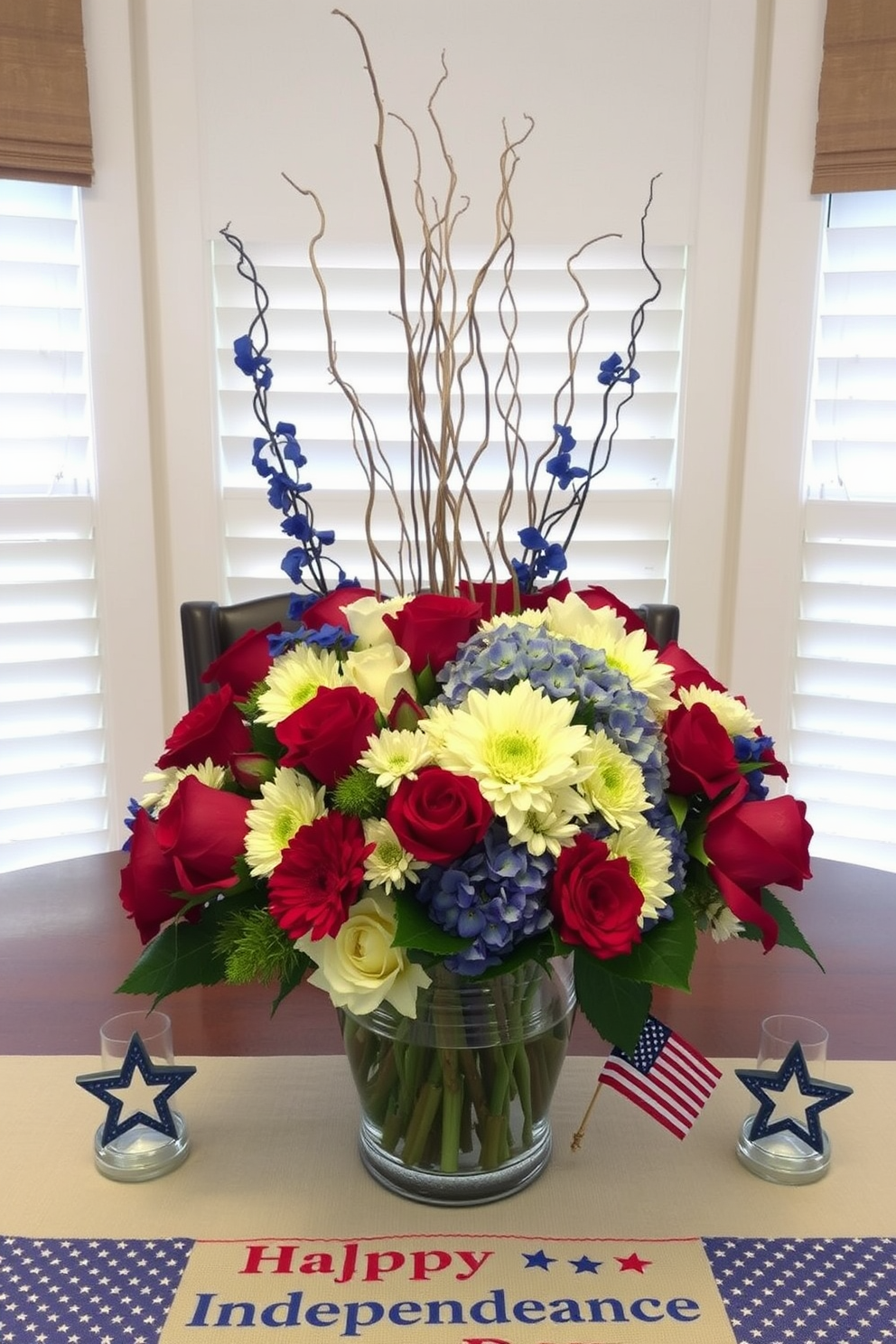 A vibrant Fourth of July centerpiece features a large glass vase filled with an assortment of red white and blue flowers such as roses daisies and hydrangeas. Surrounding the vase are small decorative stars and stripes accents along with a festive table runner that celebrates Independence Day.