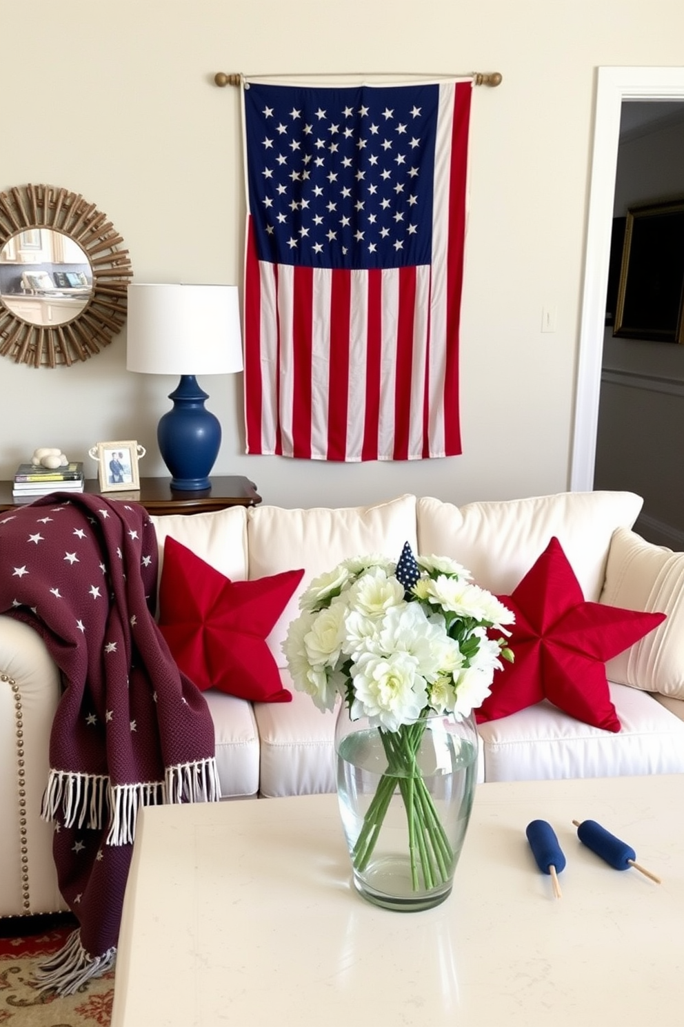 A cozy living room decorated for Independence Day features star-shaped fairy lights draped across the ceiling, casting a warm and inviting glow. The space is adorned with red, white, and blue accents, including throw pillows and a festive banner, creating a cheerful atmosphere for celebrating the holiday.