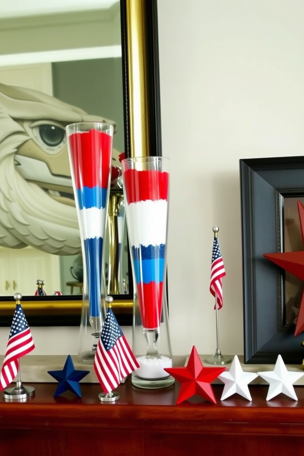 A festive mantel adorned with glass vases filled with layers of colored sand in red white and blue. The vases vary in height and are arranged alongside small American flags and star-shaped decorations to celebrate Independence Day.