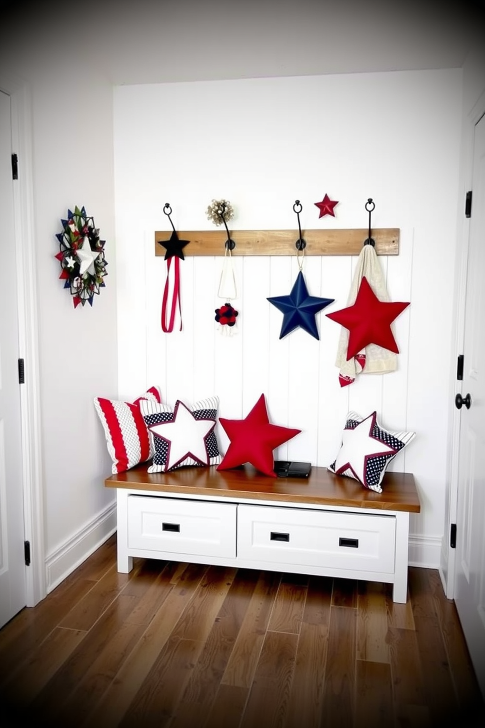 A cozy mudroom adorned with star shaped decorative pillows in red white and blue. The walls are painted a crisp white while the floor features a durable wood finish for a welcoming touch. A bench with storage underneath is placed against one wall providing functionality and style. Above the bench, a series of hooks in a vintage finish hold festive accessories for easy access.