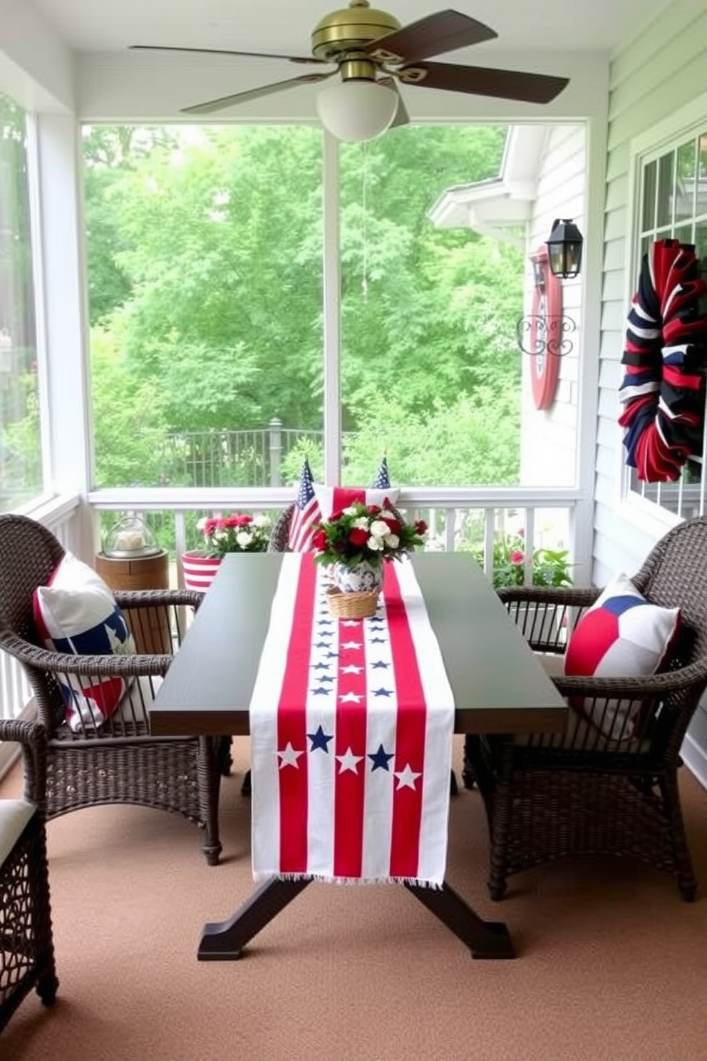 A patriotic table centerpiece featuring small American flags arranged in a rustic wooden box. Surrounding the box are red white and blue flowers adding a festive touch for Independence Day. The sunroom is adorned with light sheer curtains allowing natural light to filter in. A comfortable seating area includes cushions in patriotic colors creating a welcoming atmosphere for summer gatherings.