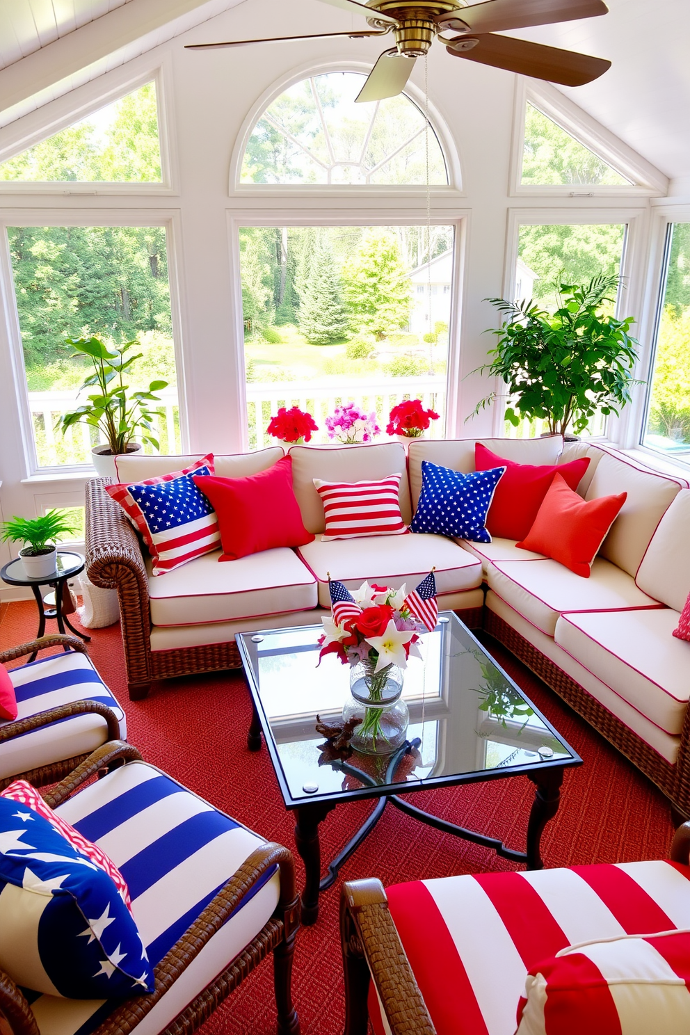 A vibrant sunroom filled with furniture in bright red, white, and blue colors. The seating includes a plush sectional sofa adorned with patriotic throw pillows and a glass coffee table topped with a decorative centerpiece featuring stars and stripes.