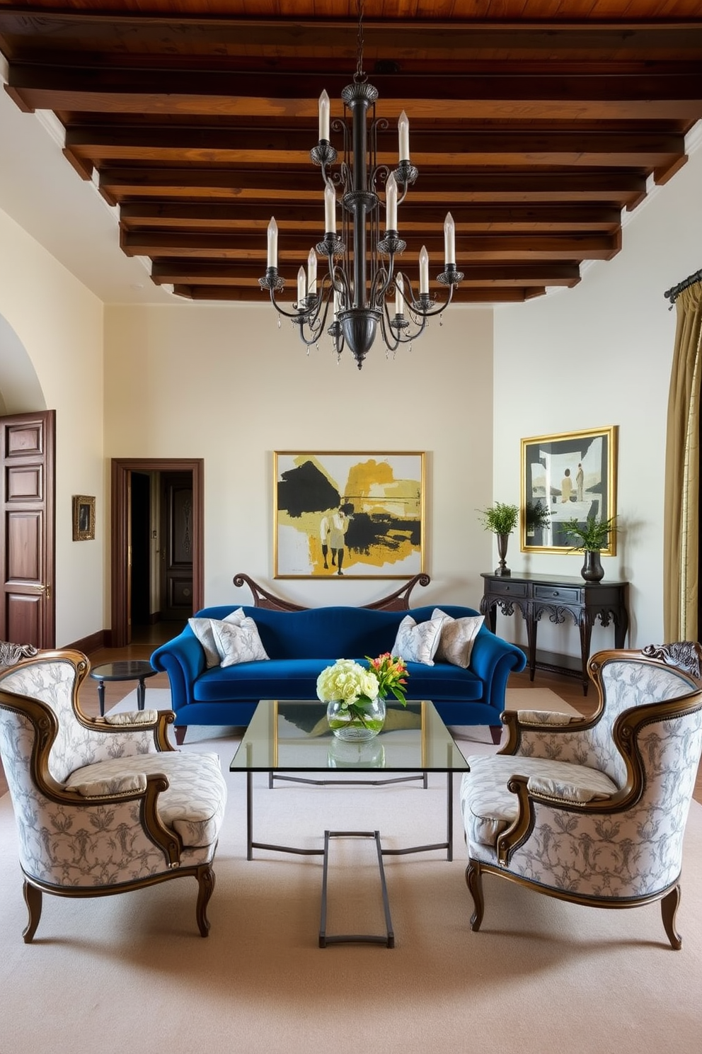 A classic Italian living room featuring elegant furniture with a modern twist. The room showcases a plush velvet sofa in deep blue, paired with a sleek glass coffee table and ornate side chairs upholstered in a subtle floral pattern. Rich wooden beams adorn the ceiling, while the walls are painted in a soft cream color. A statement chandelier hangs above, and a large abstract painting adds a contemporary touch to the traditional space.