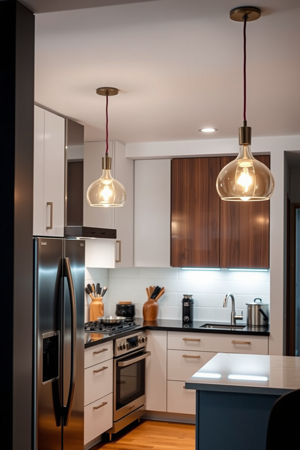 A stylish kitchen alcove features elegant pendant lights hanging gracefully over the cooking area. The warm glow from the lights enhances the inviting atmosphere, complementing the sleek cabinetry and modern appliances.