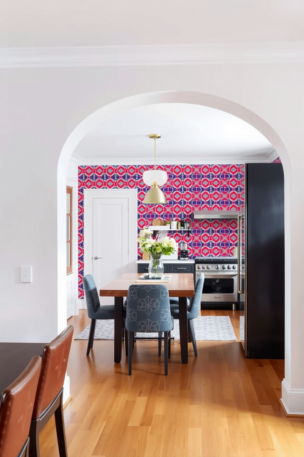 A simple archway frames the entrance to the kitchen, creating an inviting transition from the dining area. The bold wallpaper backdrop features a vibrant geometric pattern that adds a striking visual element to the space.