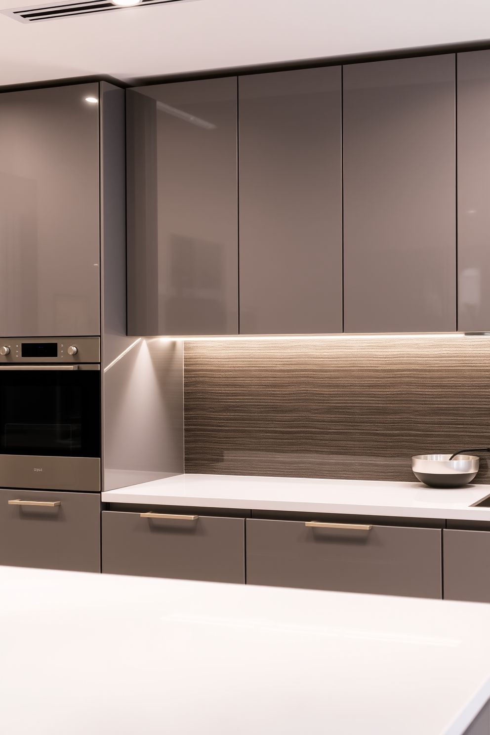 Sleek modern cabinets with minimal hardware create a clean and sophisticated look in the kitchen. The cabinetry features a smooth finish in a soft matte color, enhancing the contemporary aesthetic while maximizing storage efficiency.