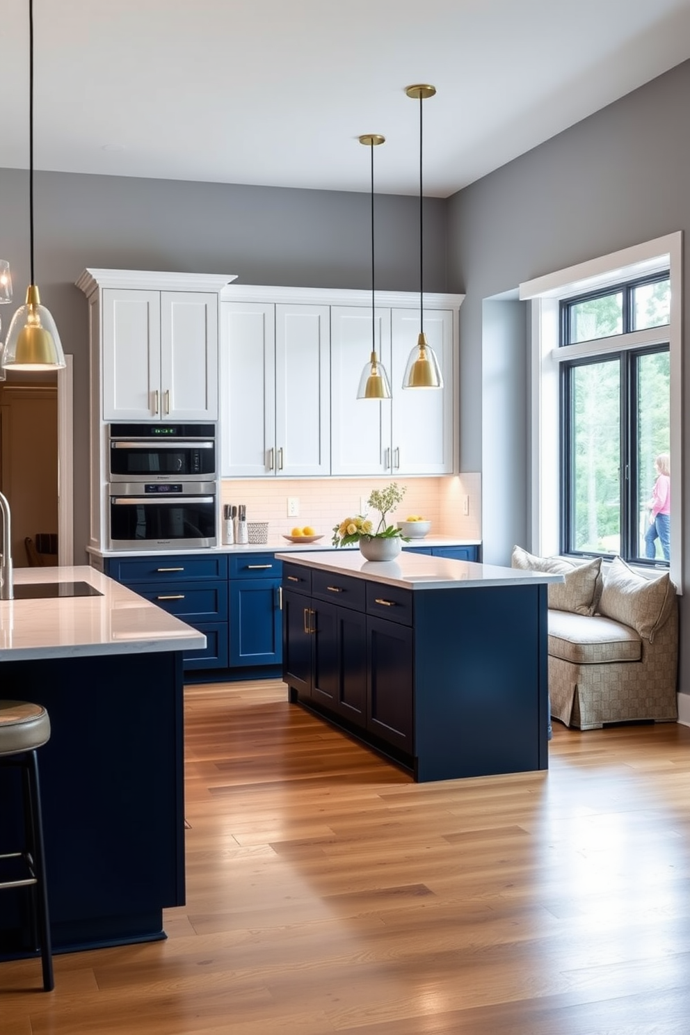 A modern kitchen featuring sleek white cabinets paired with a rich navy blue island. The island boasts a waterfall countertop made of polished quartz, while the cabinets are adorned with brushed gold hardware. The space is illuminated by pendant lights hanging above the island, creating a warm and inviting atmosphere. A cozy breakfast nook with upholstered seating is nestled beside a large window, offering a view of the outdoors.