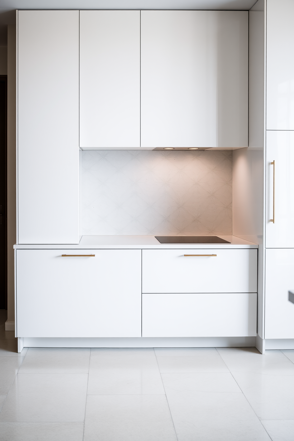 A sleek kitchen featuring minimalist cabinets with clean lines and a glossy finish. The cabinets are designed in a soft white color, creating a bright and airy atmosphere. The countertop is a smooth quartz surface that complements the cabinetry. A subtle backsplash in a light gray adds texture without overwhelming the space.