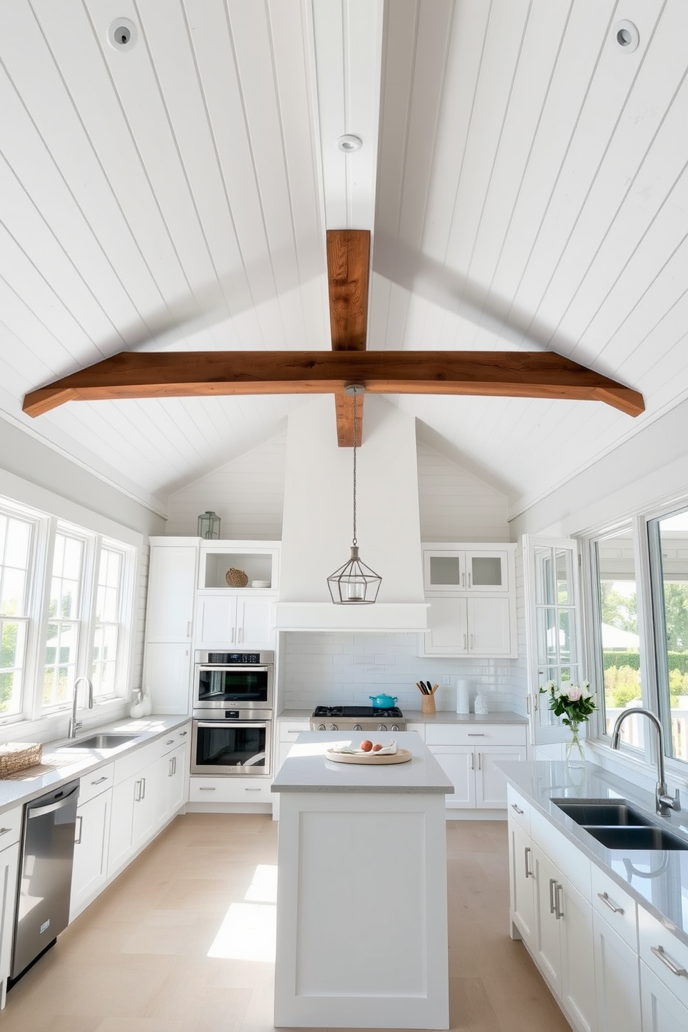 A bright and airy kitchen featuring a shiplap ceiling that enhances the coastal vibe. The ceiling is painted in a soft white, creating a seamless flow with the light-colored walls and cabinetry. Natural light floods the space through large windows, illuminating the open layout. A rustic wooden beam runs across the ceiling, adding warmth and character to the modern design.