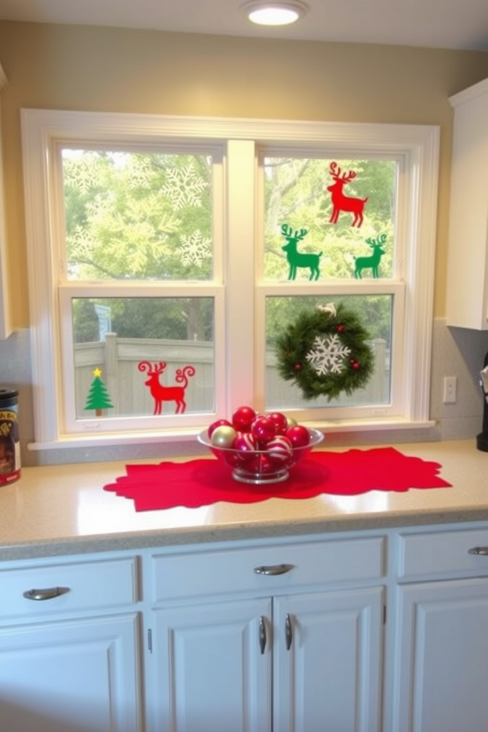 A cozy kitchen adorned with festive holiday-themed window clings featuring snowflakes and reindeer. The countertops are decorated with a vibrant red tablecloth, and a bowl of ornaments sits in the center, adding a cheerful touch to the space.