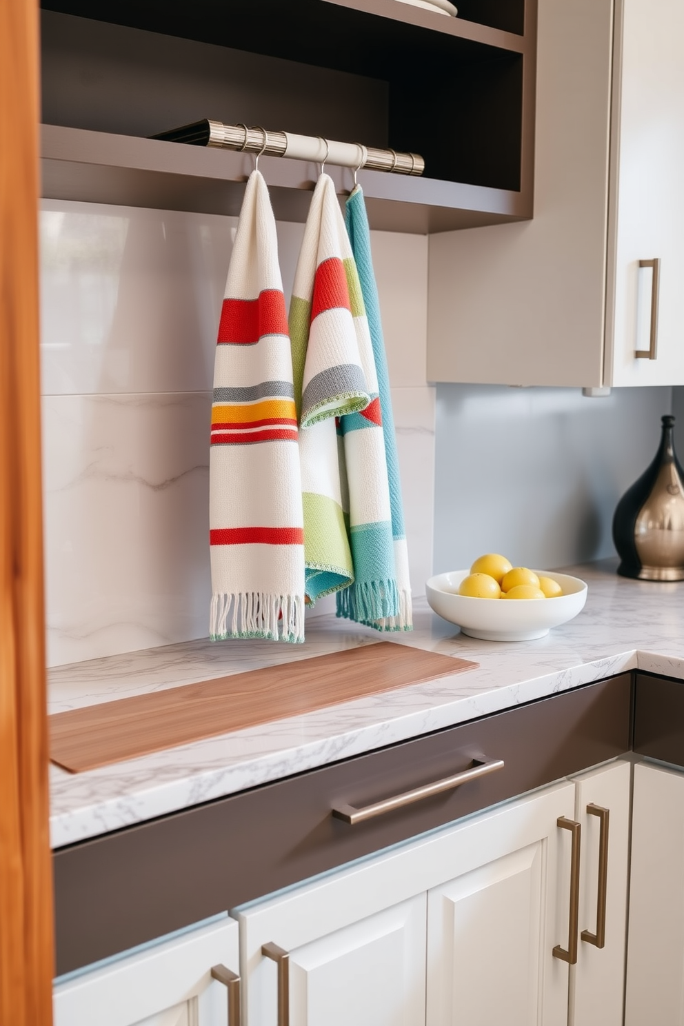 A stylish kitchen setting featuring color-coordinated dish towels that complement the overall decor. The dish towels are neatly arranged on a hanging rack above a sleek kitchen countertop. The countertop showcases a beautiful blend of materials, including polished granite and warm wood accents. Underneath, spacious cabinets provide ample storage while maintaining a cohesive and inviting aesthetic.