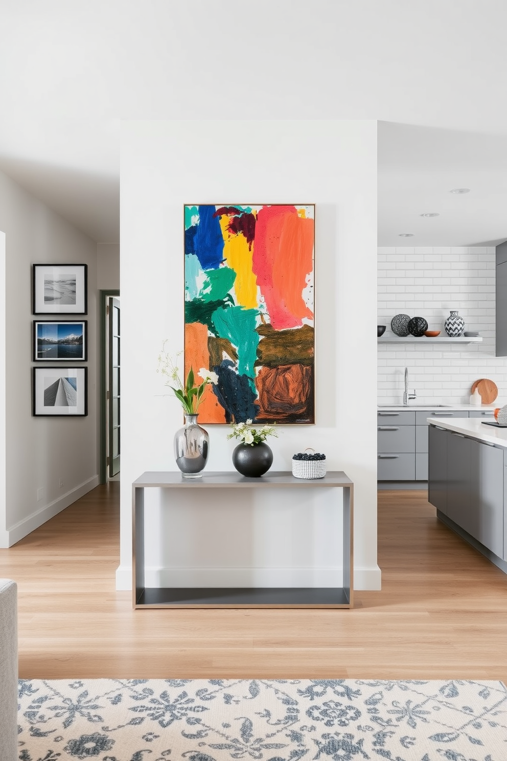 Artistic wall decor to personalize space. A large abstract painting in vibrant colors hangs above a sleek console table, complemented by a collection of smaller framed artworks arranged in a gallery style. Kitchen design ideas. An open-concept kitchen features a large island with bar seating, surrounded by modern cabinetry in a soft gray finish, and a stylish backsplash made of white subway tiles.