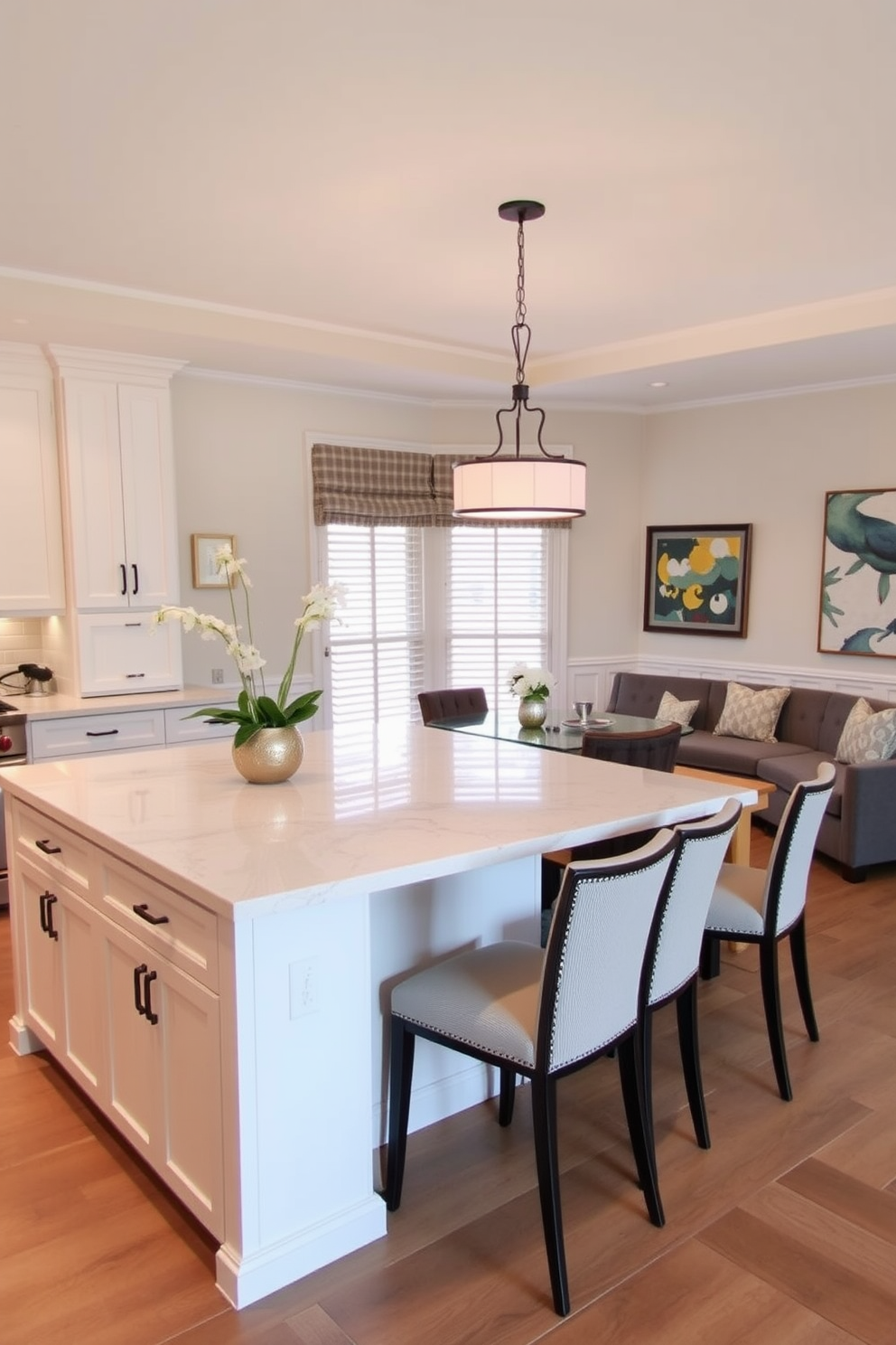 A multi-functional kitchen island features a sleek quartz countertop that extends into a cozy dining area. The island includes integrated seating with stylish bar stools on one side and a built-in bench with cushions on the other. The dining area is defined by a modern pendant light above the table, creating an inviting atmosphere. Surrounding the table are elegant chairs that complement the island's design, enhancing the overall aesthetic of the room.