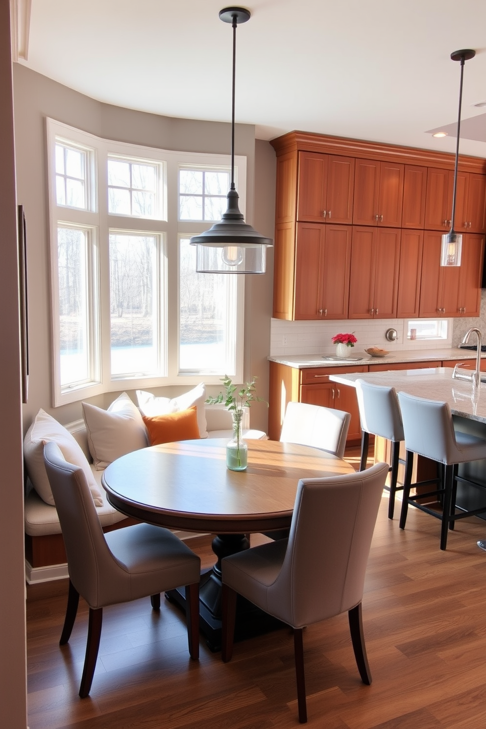 A cozy breakfast nook with a round wooden table surrounded by upholstered chairs is positioned near a large window, allowing natural light to flood the space. The nook is adorned with soft cushions and a pendant light hanging above, creating an inviting atmosphere for family gatherings. The kitchen features sleek cabinetry in a warm tone, complemented by a spacious island with bar stools for casual dining. Adjacent to the kitchen, the family room boasts a comfortable sectional sofa and a stylish coffee table, forming a seamless flow between cooking and relaxation areas.