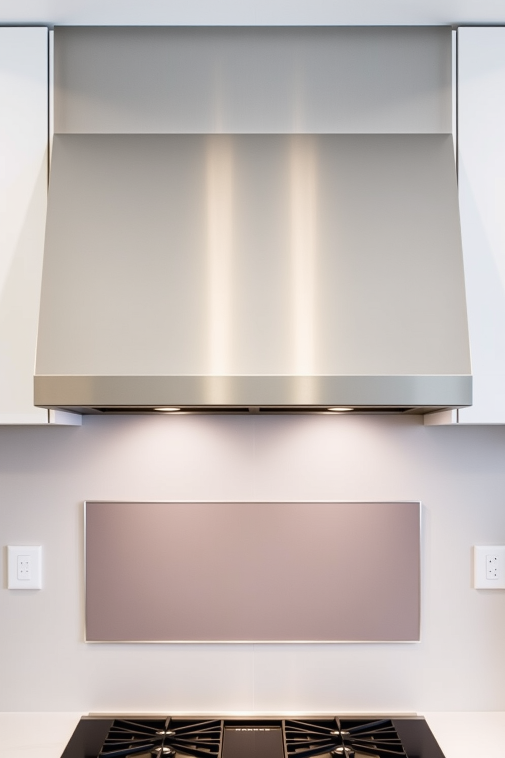 A sleek modern stainless steel canopy hood is the centerpiece of the kitchen, featuring clean lines and a polished finish. It is suspended above a large kitchen island with a beautiful quartz countertop, creating a seamless blend of style and functionality. The hood is complemented by minimalist cabinetry in a soft white color, providing ample storage space. Underneath, subtle LED lighting illuminates the cooking area, enhancing the contemporary aesthetic of the kitchen.