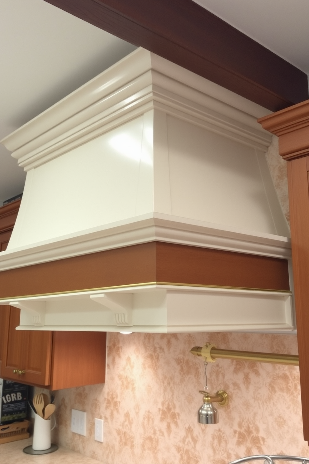 A cozy cottage chic kitchen hood adorned with intricate decorative trim. The hood features a soft white finish complemented by rustic wood accents, creating a warm and inviting focal point in the kitchen.