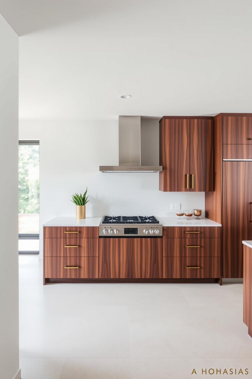 A sleek kitchen design featuring an integrated hood seamlessly built into the cabinetry. The cabinetry is finished in a rich walnut with brass hardware, creating a warm and inviting atmosphere.