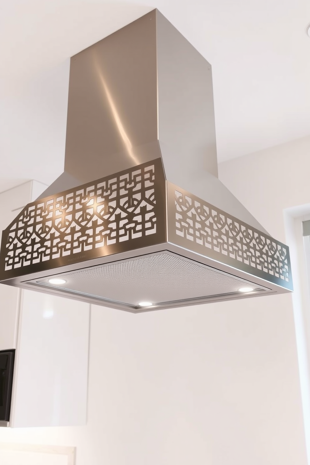 A striking kitchen hood design featuring a geometric pattern that adds a modern touch to the space. The hood is crafted from sleek stainless steel with intricate cutouts that create a stunning visual effect.