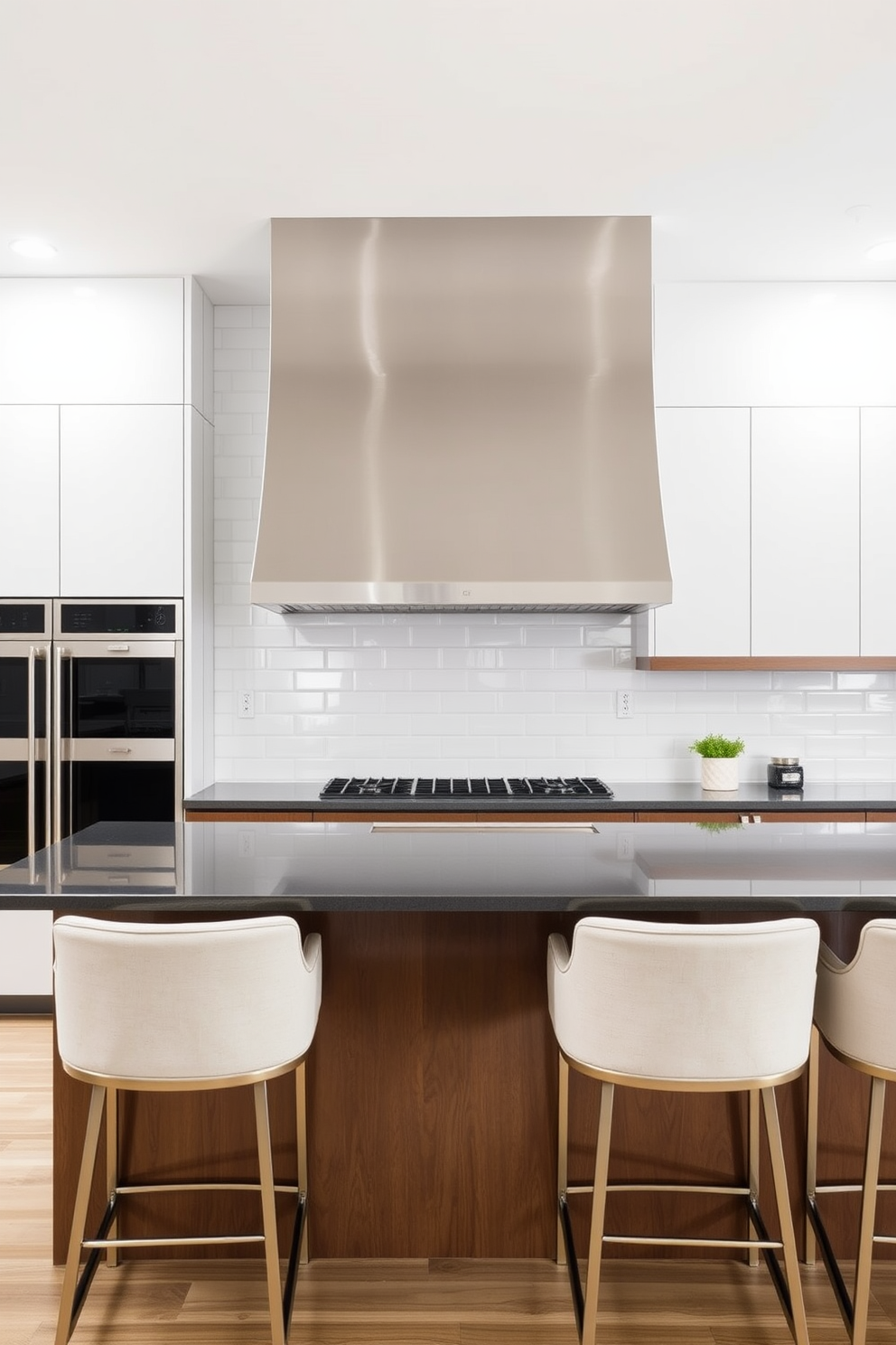 A contemporary kitchen island features a sleek curved hood that seamlessly integrates with the cabinetry. The hood is finished in brushed stainless steel, complementing the minimalist aesthetic of the space. Surrounding the island are elegant bar stools with soft upholstery, inviting casual dining. The backsplash is a glossy white subway tile, reflecting light and enhancing the airy feel of the kitchen.