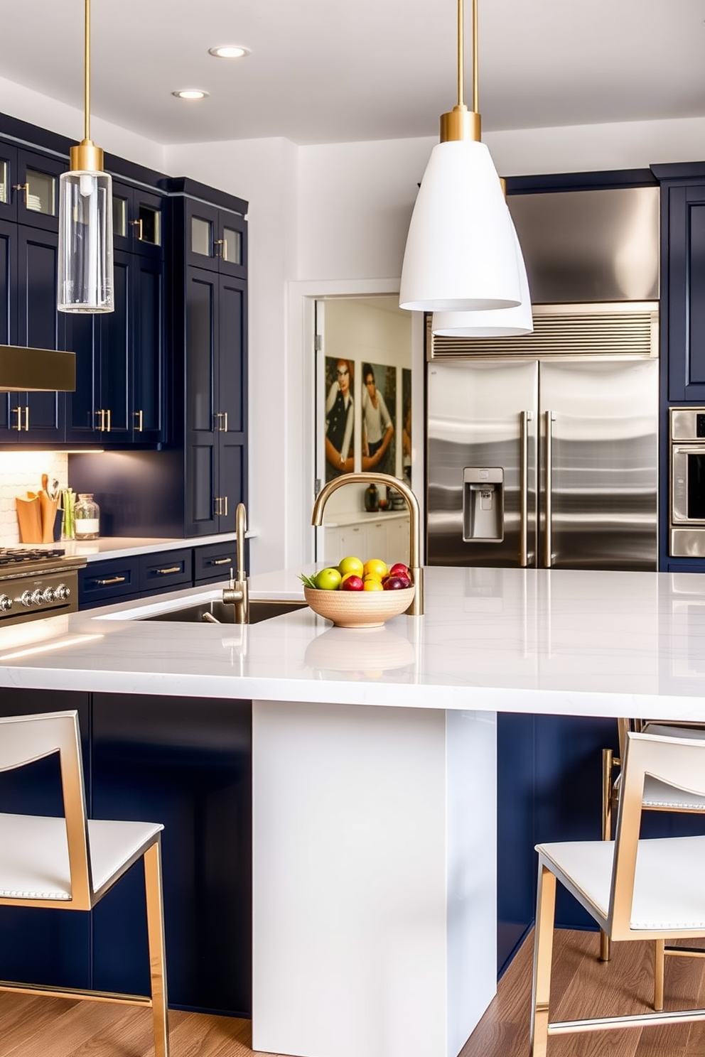 A modern kitchen island featuring an integrated sink that blends seamlessly into the countertop. The island is surrounded by sleek bar stools and is illuminated by pendant lights hanging above. The cabinetry is a rich navy blue, complemented by brass hardware and a white quartz countertop. A stylish fruit bowl sits at the center of the island, adding a pop of color to the elegant design.