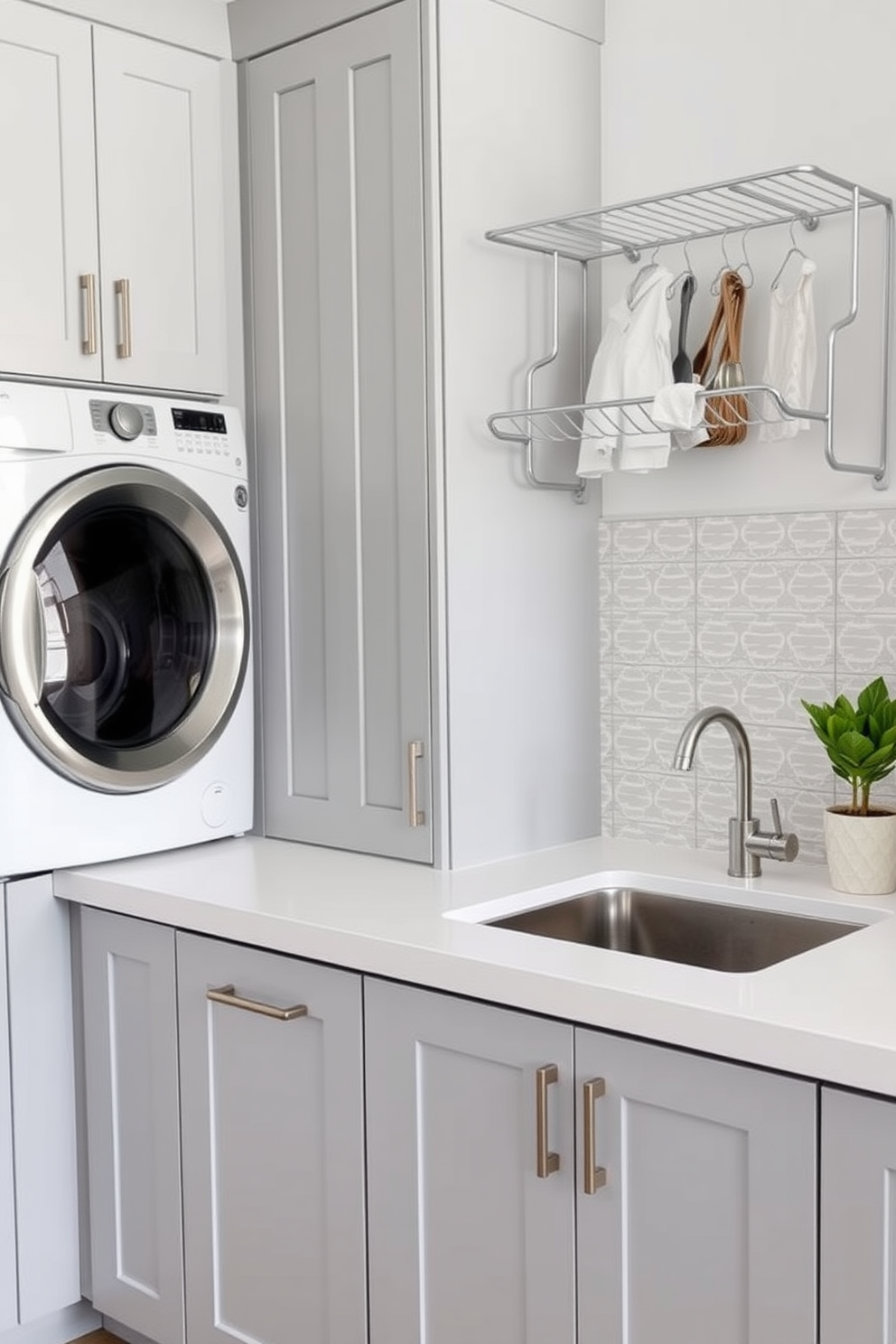 A bright and airy laundry room adjacent to a kitchen pantry features white cabinetry and a sleek countertop for folding clothes. The walls are painted a soft gray, and the floor is adorned with light-colored tiles that enhance the spacious feel. Incorporated into the design are modern appliances in stainless steel, seamlessly blending with the cabinetry. A small window allows natural light to flood the space, while a decorative basket holds laundry essentials neatly.