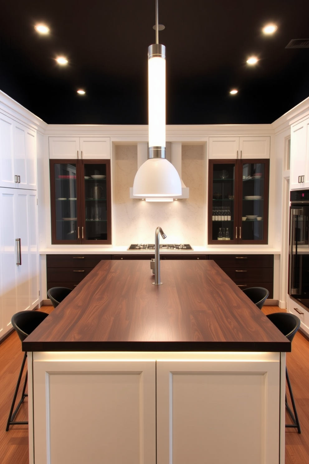 A modern kitchen featuring a large island with a sleek marble countertop. Above the island, three elegant pendant lights hang, casting a warm glow over the space. The kitchen cabinets are a rich navy blue, contrasting beautifully with the light wood flooring. Large windows allow natural light to flood in, enhancing the inviting atmosphere.