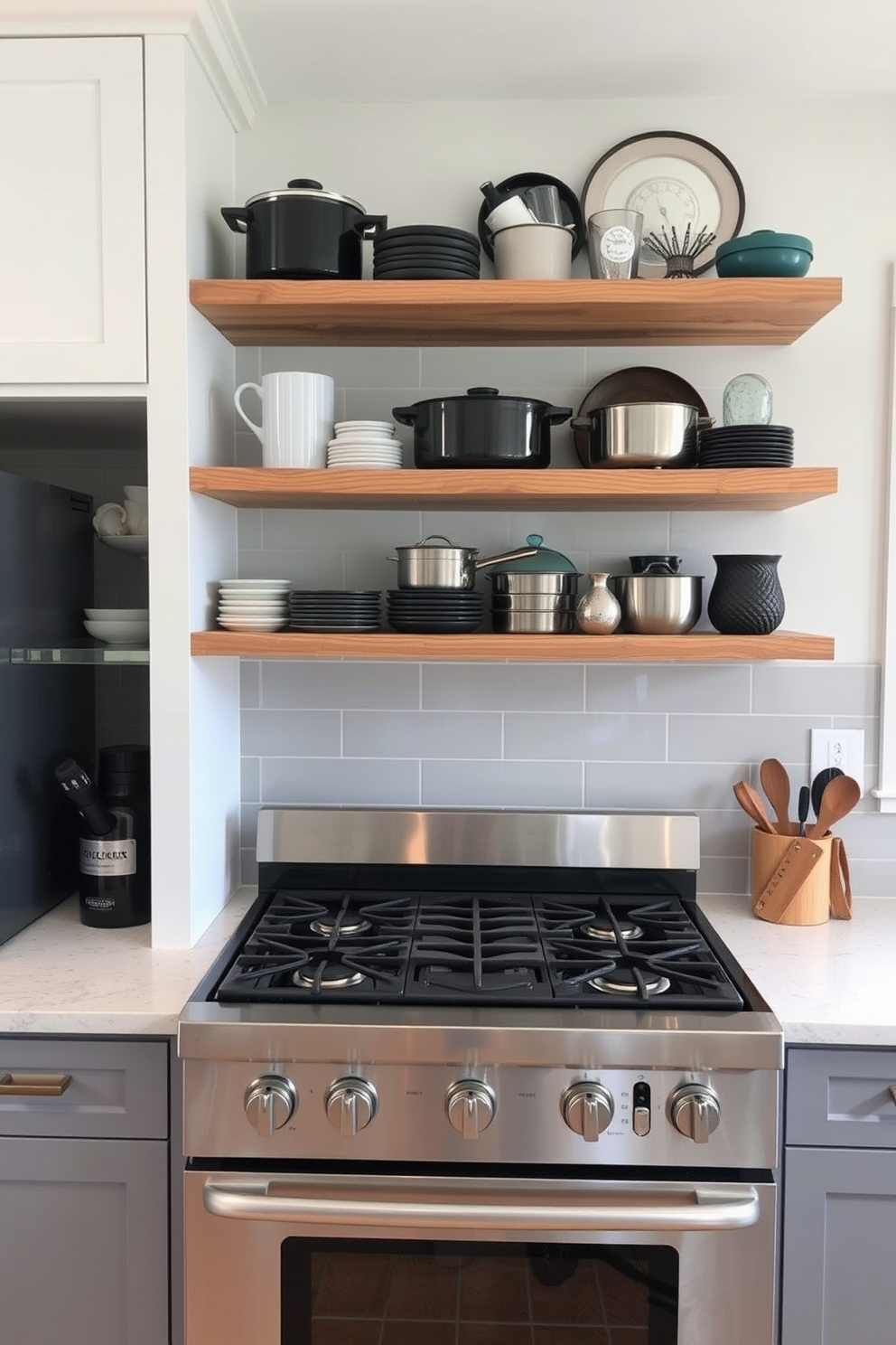 A modern kitchen featuring open shelving above the stove area. The shelves are made of reclaimed wood and display an array of stylish cookware and decorative items. The stove is a sleek stainless steel design with a five-burner layout. A stylish backsplash in a soft gray complements the overall aesthetic of the kitchen.