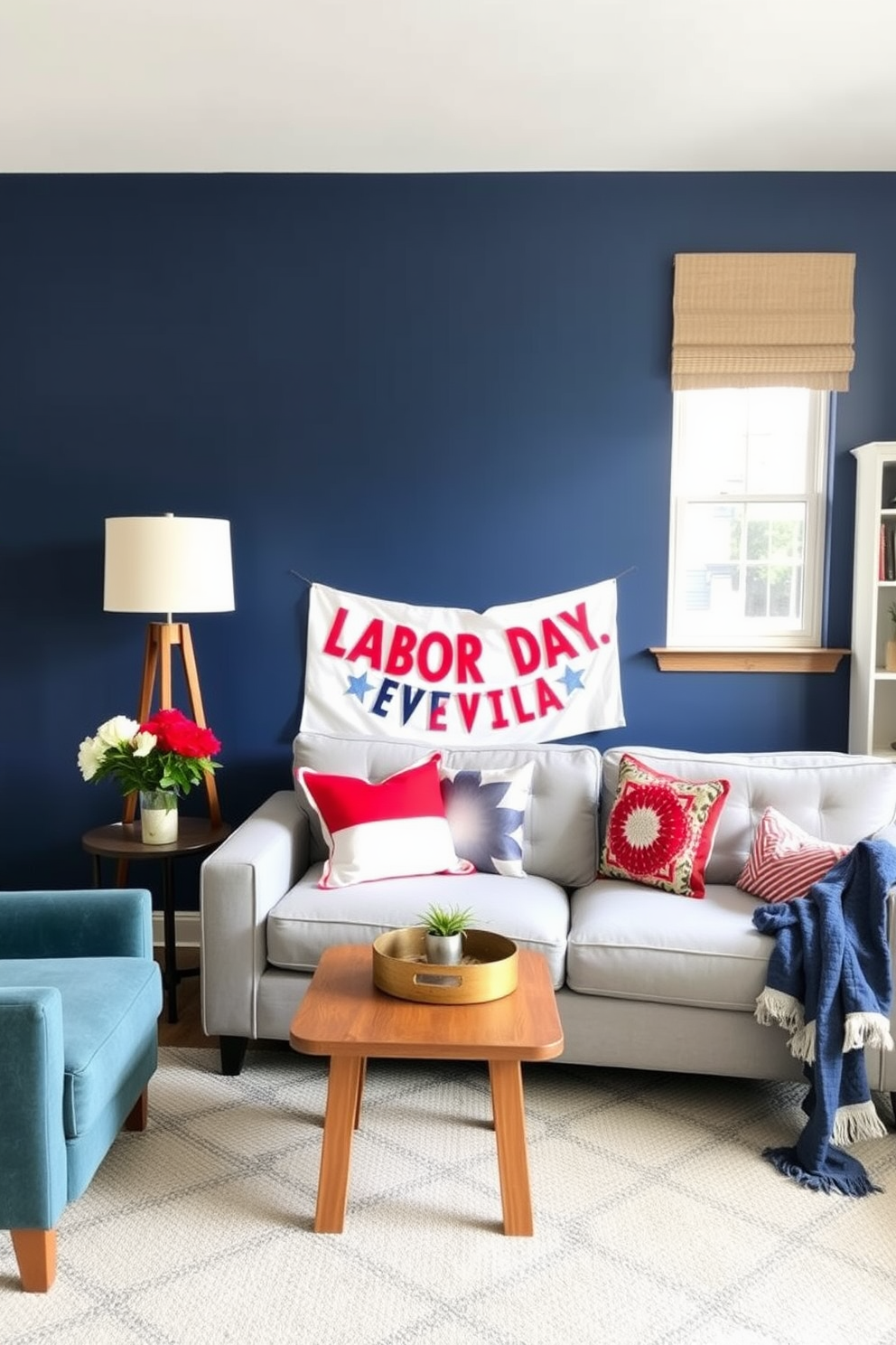 A vibrant accent wall in a cozy apartment living room. The wall is painted in a rich navy blue, contrasting beautifully with the light gray furniture and warm wood accents. Decorate the space with festive Labor Day-themed decor. Incorporate red, white, and blue throw pillows and a stylish banner that celebrates the holiday spirit.