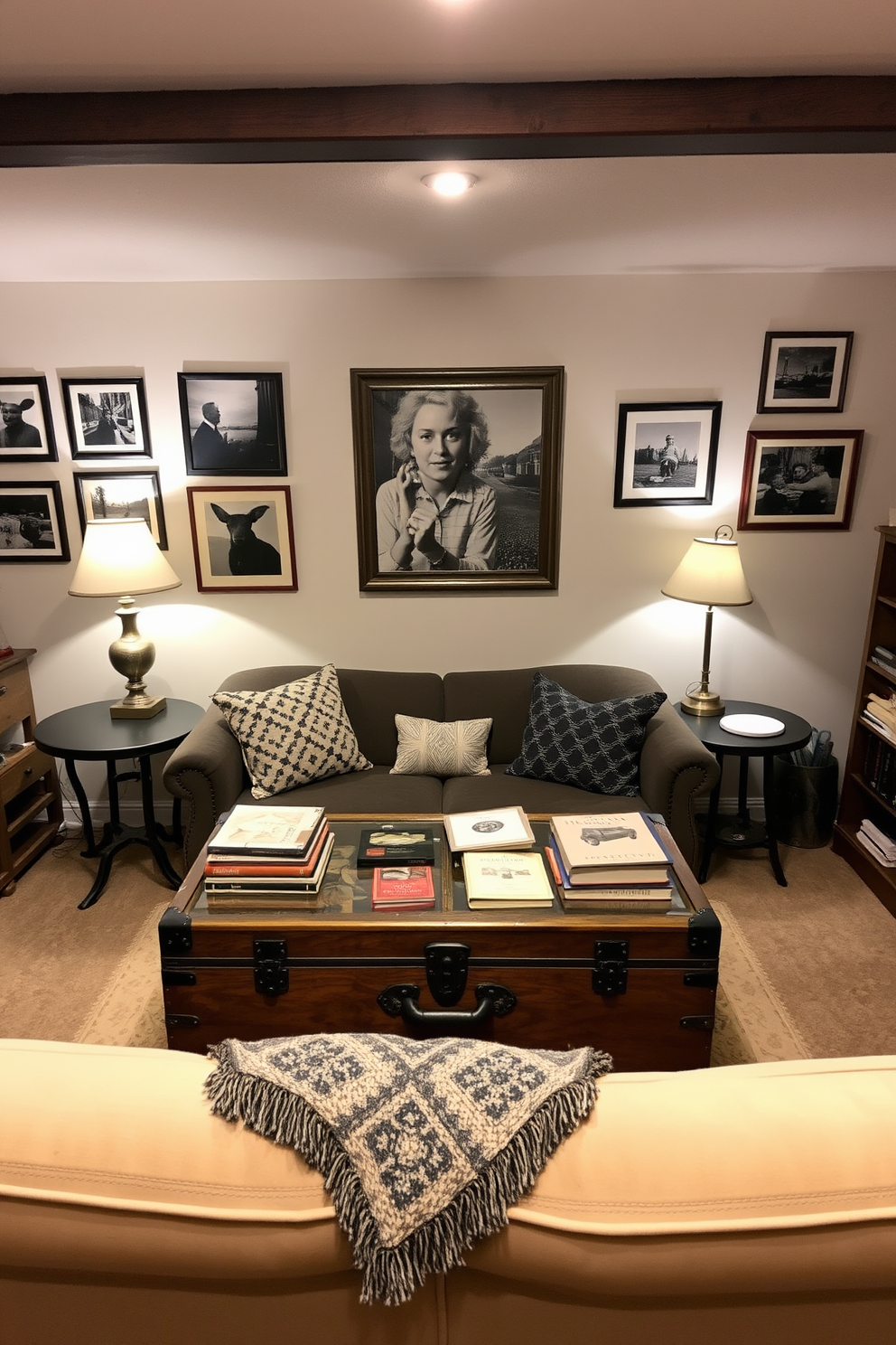 A cozy basement setting filled with vintage decor elements that evoke a nostalgic vibe. The walls are adorned with framed black and white photographs, and an antique wooden trunk serves as a coffee table in the center of the room. Soft lighting from retro lamps creates a warm atmosphere. A collection of vintage books and a patterned throw blanket are arranged on a plush sofa, inviting relaxation and comfort.