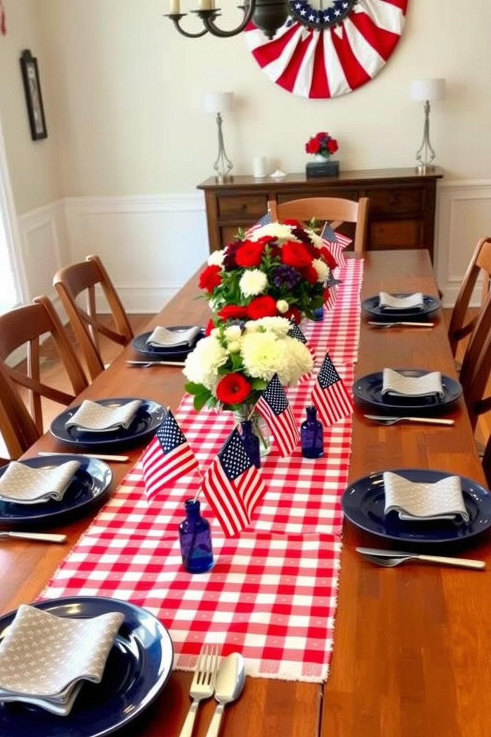 A festive dining room setting for Labor Day featuring a long wooden table set for a celebration. Mini American flags are placed in small vases at each table setting, adding a patriotic touch to the decor. The table is adorned with a red and white checked tablecloth, complemented by blue dinnerware. Fresh flowers in red, white, and blue hues are arranged in the center, creating a vibrant focal point.