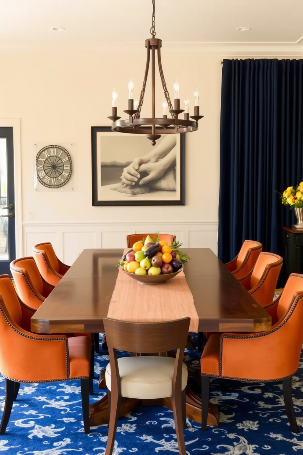 A beautifully arranged dining room showcasing a large wooden table adorned with seasonal fruits in decorative bowls. The room is illuminated by a stunning chandelier, and the walls are painted in a warm, inviting color that enhances the cozy atmosphere. The table is set with elegant dinnerware and soft linen napkins, creating a festive yet sophisticated look for Labor Day celebrations. Surrounding the table are comfortable chairs, and a vibrant centerpiece of fresh flowers adds a touch of seasonal charm.