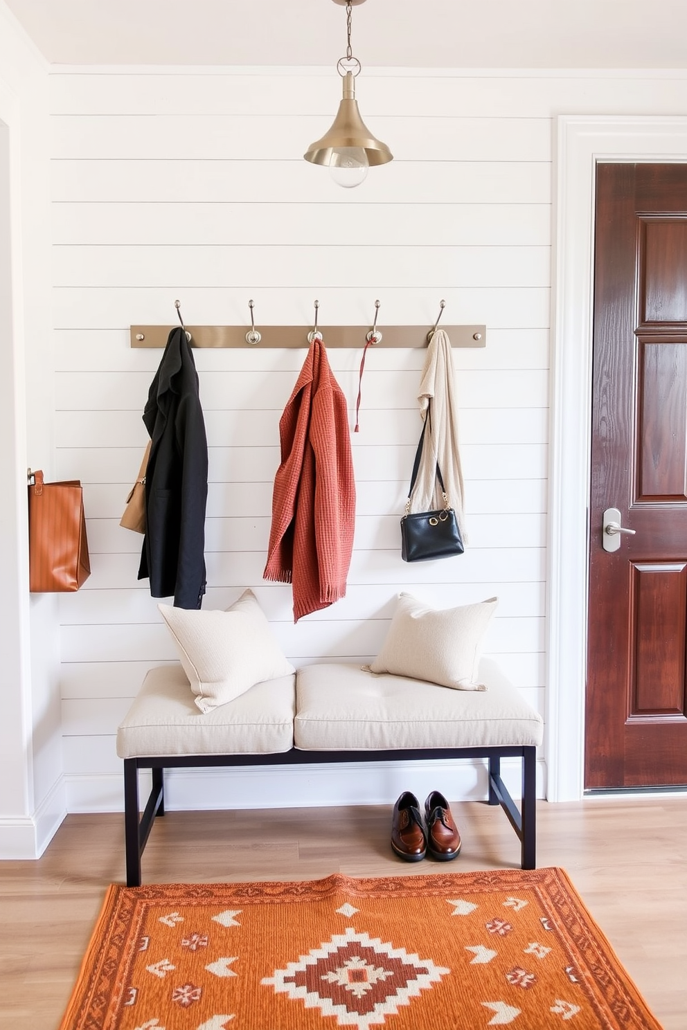 A charming entryway featuring a rustic mirror framed in reclaimed wood, adding depth and character to the space. The walls are adorned with warm, inviting colors, while a stylish console table holds seasonal decorations for Labor Day, including small flags and a festive centerpiece.