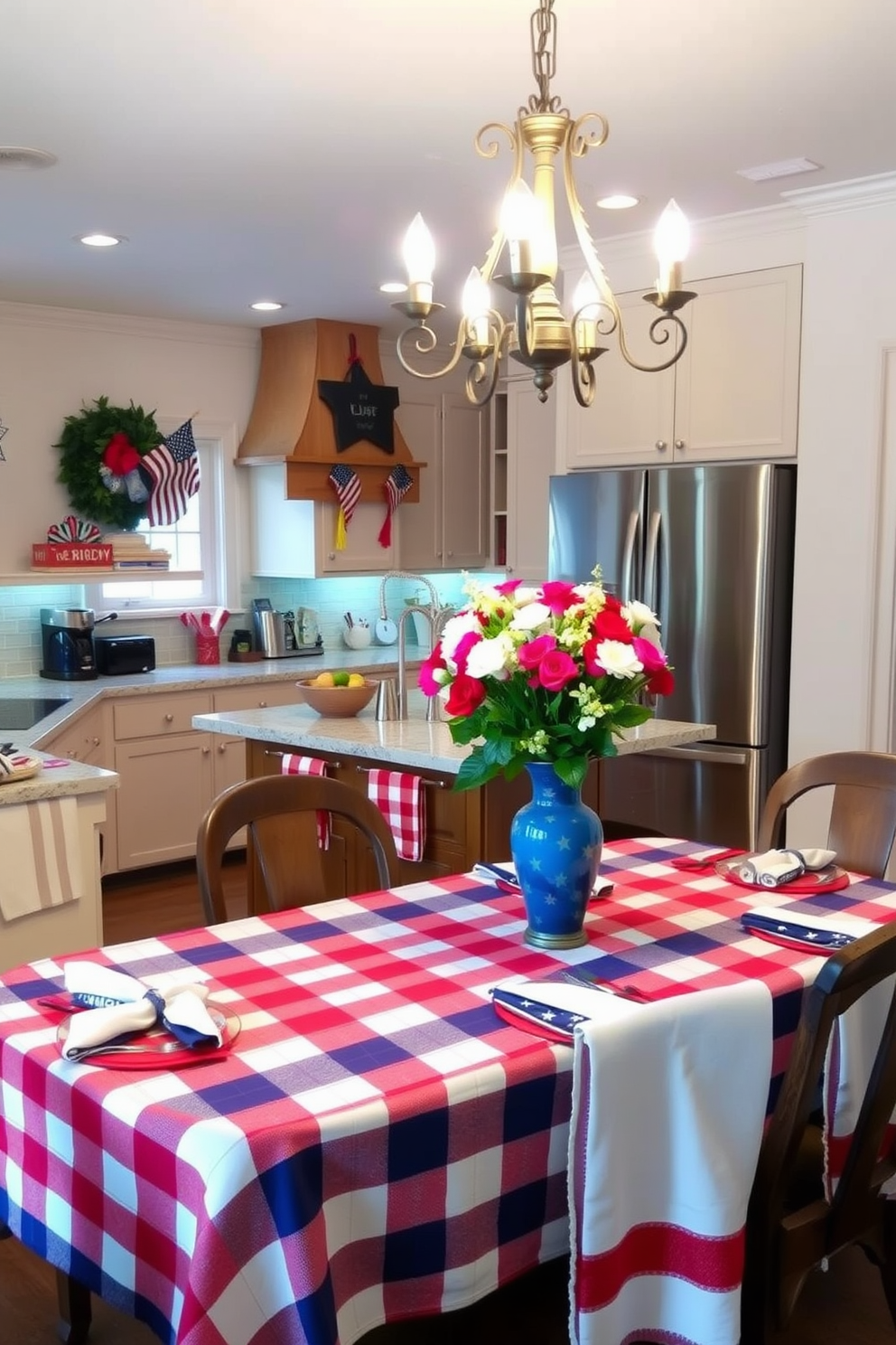 A cozy kitchen adorned with red, white, and blue linens. The table is set with a checkered tablecloth featuring vibrant colors, complemented by matching napkins and dish towels. Above the kitchen island, a rustic chandelier illuminates the space, creating a warm and inviting atmosphere. Decorative accents, such as a bouquet of fresh flowers in a blue vase, enhance the festive Labor Day theme.