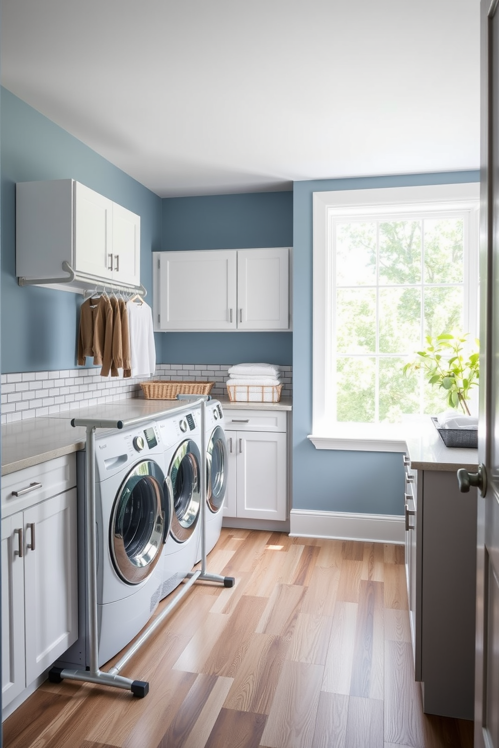 A modern laundry room featuring a sleek drying rack positioned near a spacious countertop for folding clothes. The walls are painted in a soft blue hue, complemented by white cabinetry and a stylish tile backsplash. The floor is covered in a durable vinyl that mimics wood, providing both warmth and practicality. A large window allows natural light to flood the space, enhancing the cheerful atmosphere of this functional area.