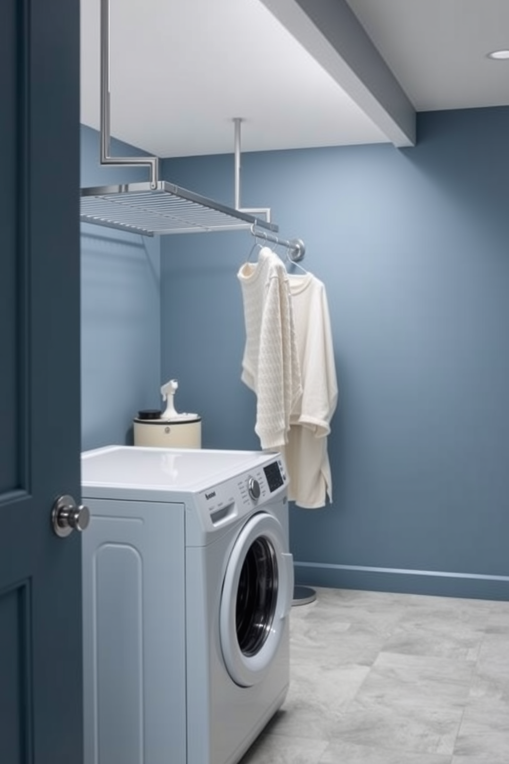 A modern laundry room featuring a stylish hanging bar made of sleek metal. The walls are painted in a soft blue hue, and the floor is adorned with light grey tiles for a clean look.