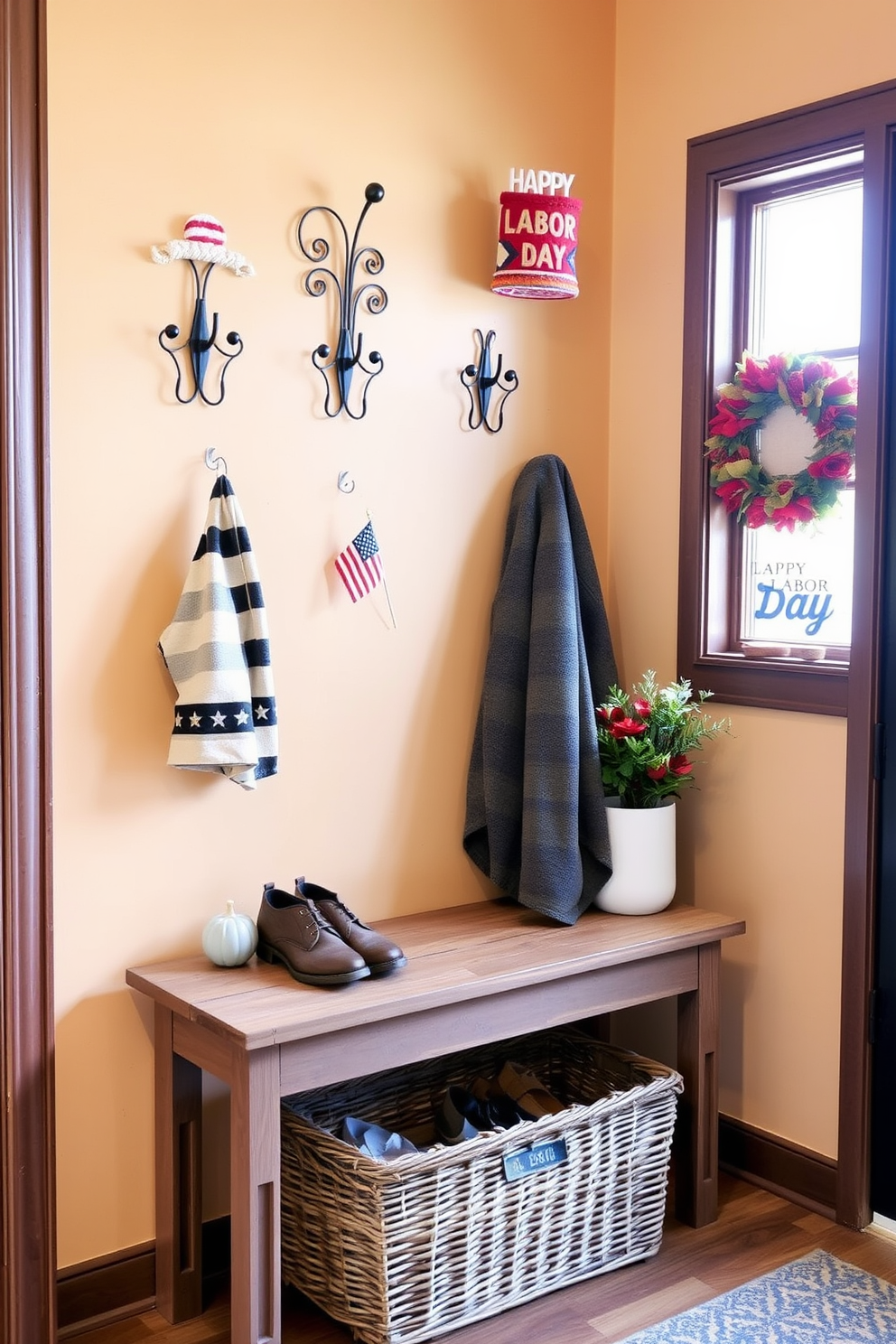 A cozy mudroom featuring decorative hooks with unique designs that add character to the space. The walls are painted in a warm neutral tone, and a rustic bench sits below the hooks for convenience. Seasonal decor elements celebrating Labor Day are displayed, including small flags and autumn-themed accents. A woven basket is placed on the floor to store shoes and outdoor gear, enhancing the inviting atmosphere.