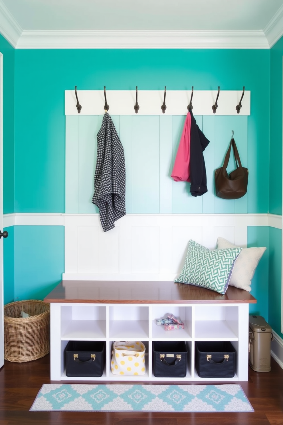 A mudroom featuring a brightly painted accent wall in a vibrant shade of teal. The space includes a built-in bench with storage cubbies below and hooks above for coats and bags.