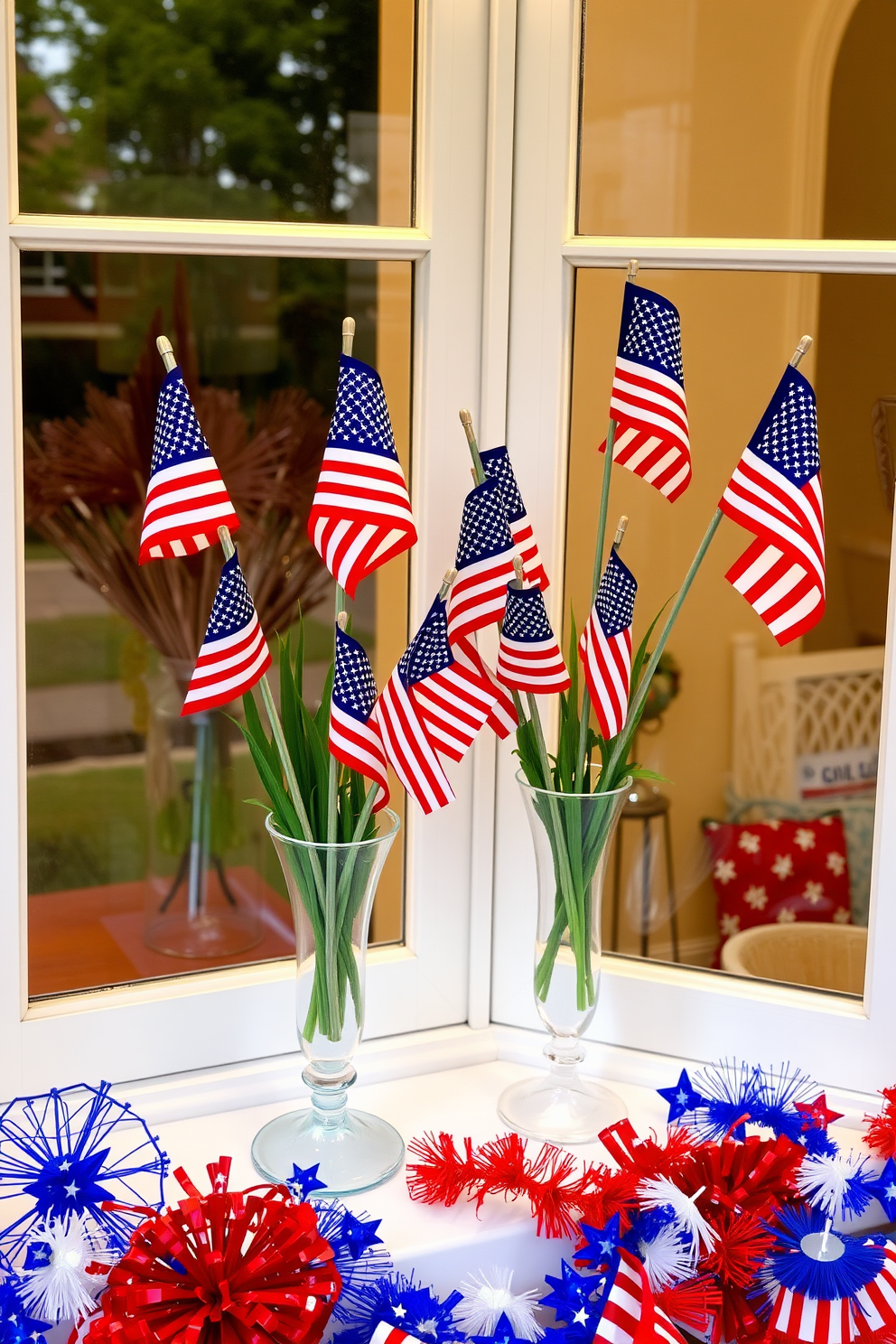 A festive window display featuring miniature American flags arranged in elegant vases. The vases are placed on a windowsill adorned with red, white, and blue decorations to celebrate Labor Day.