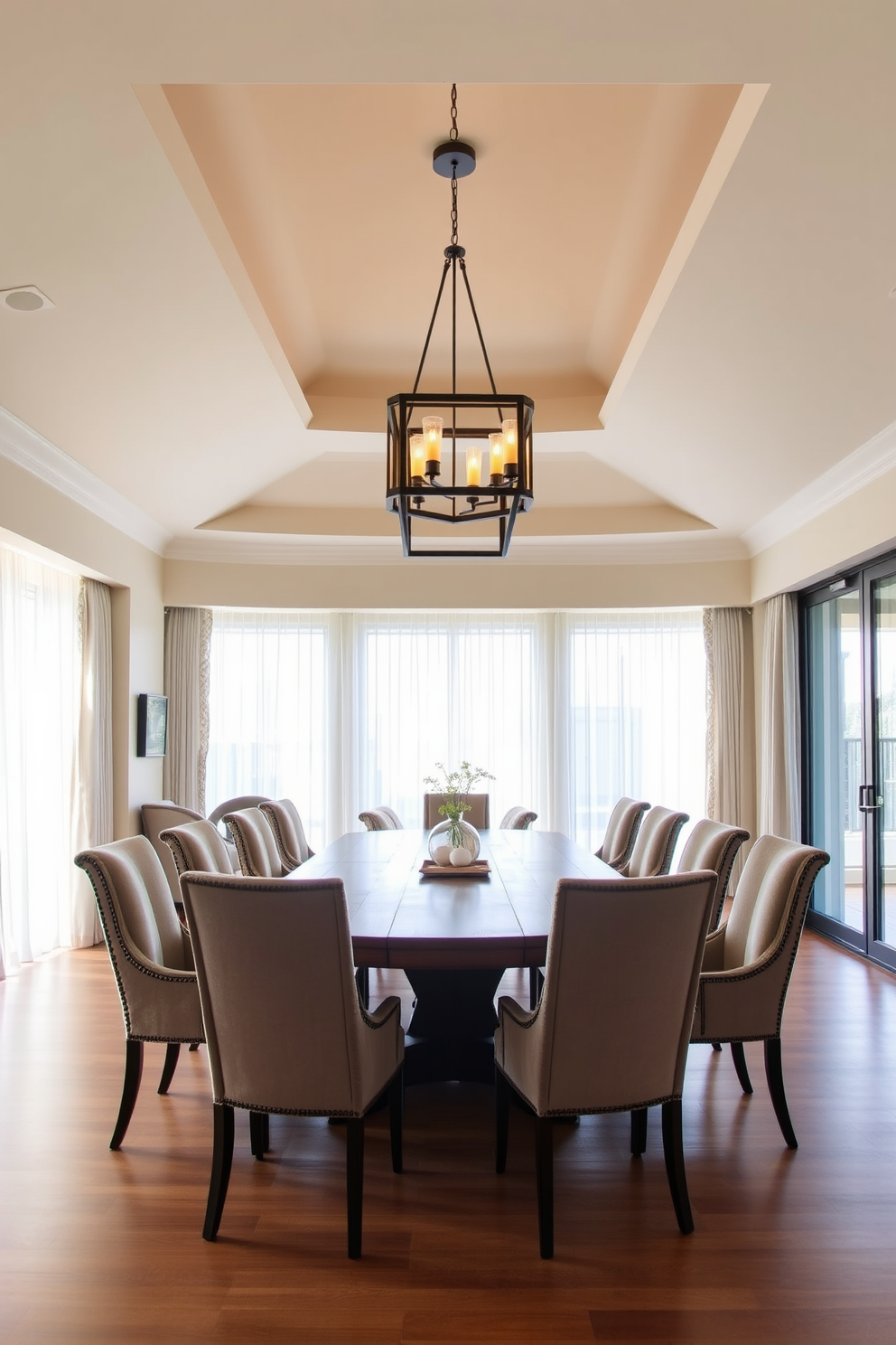 A spacious dining area features a large wooden table surrounded by elegant upholstered chairs. Above the table, a striking chandelier with geometric shapes and warm lighting creates a focal point in the room. The walls are painted in a soft neutral tone, enhancing the feeling of openness. Large windows allow natural light to flood the space, complemented by sheer curtains that add a touch of sophistication.