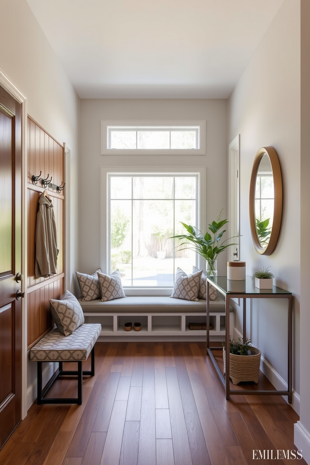 A spacious foyer designed with functional storage solutions that seamlessly blend style and practicality. The focal point is a built-in bench with storage underneath, surrounded by elegant wall hooks and a sleek console table. Natural light floods the space through large windows, highlighting the warm wood tones and inviting color palette. Decorative elements such as a large mirror and potted plants add a touch of sophistication and warmth to the entryway.