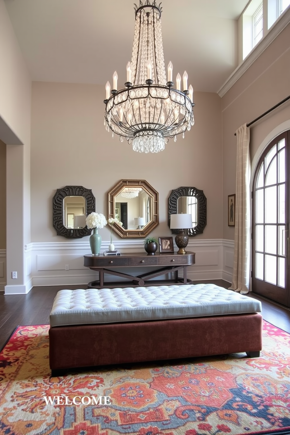 A grand foyer with an intricate ceiling design featuring ornate moldings and a stunning chandelier that draws the eye upward. The walls are adorned with elegant paneling in a soft cream color, complemented by a marble floor that adds a touch of luxury. The space is anchored by a large area rug that defines the seating area, which includes plush sofas and stylish armchairs. Tall windows allow natural light to flood the room, highlighting the exquisite details of the ceiling and the overall grandeur of the foyer.