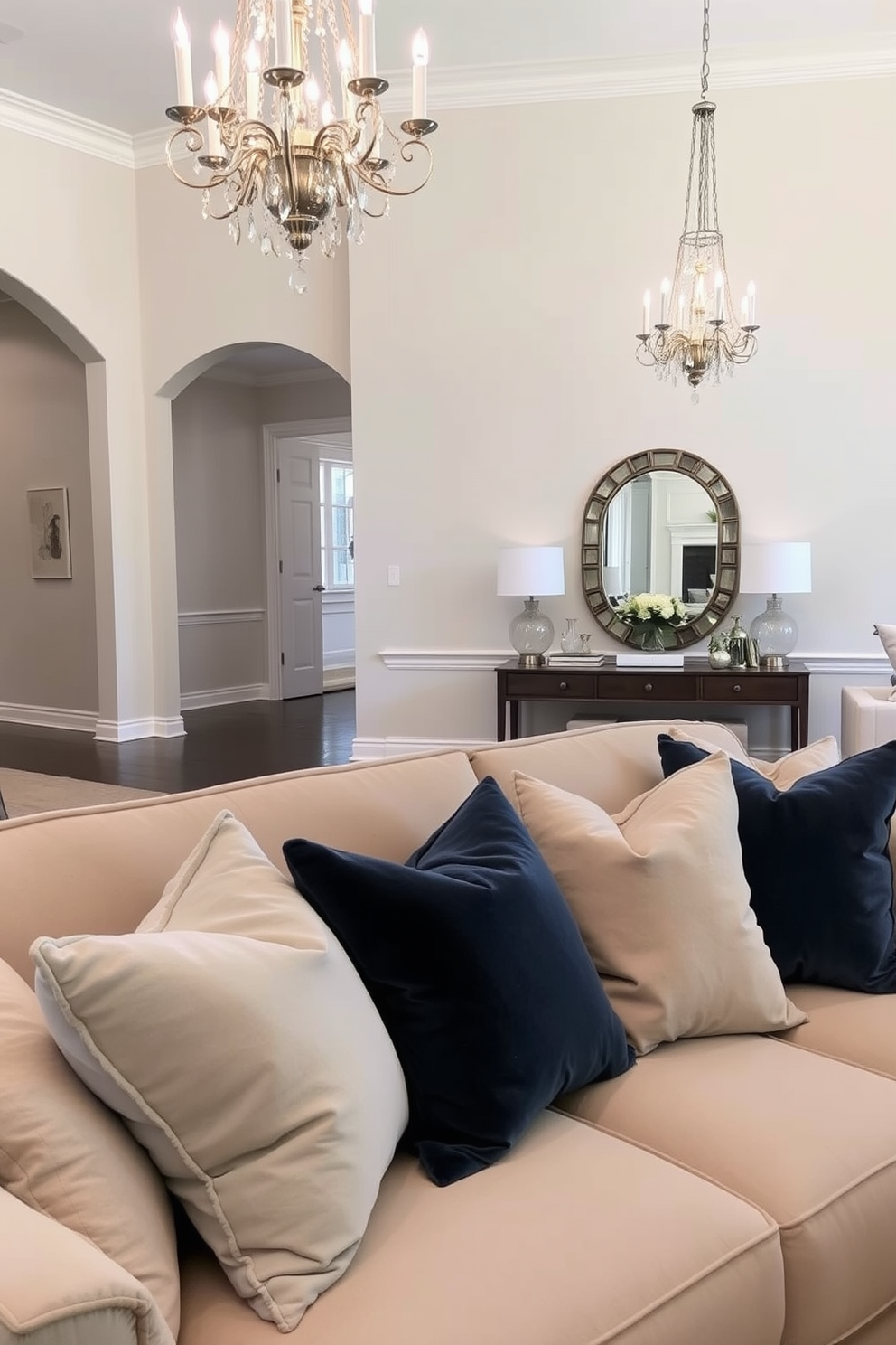 A grand foyer featuring high ceilings and an elegant chandelier that serves as the focal point. Flanking the entrance are two decorative lanterns that cast a warm ambient glow, enhancing the inviting atmosphere. The foyer is adorned with a beautiful area rug that adds a touch of color and texture to the space. A sleek console table against the wall displays decorative items and fresh flowers, creating a welcoming and stylish entryway.