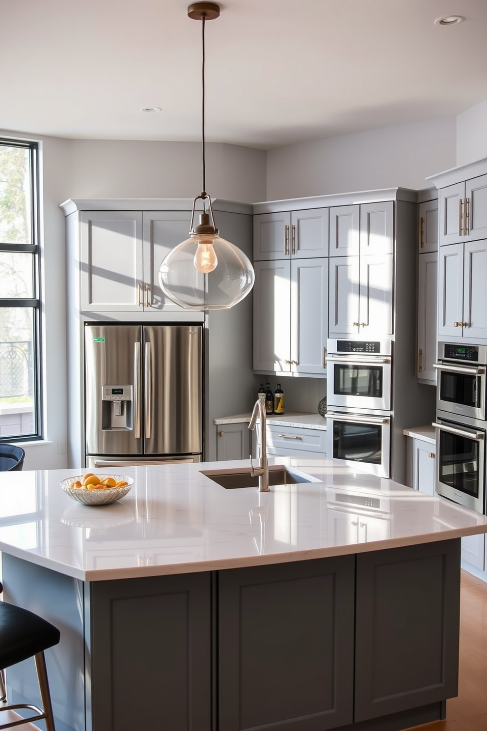 A large kitchen featuring smart appliances seamlessly integrated into the design. The space includes a spacious island with a quartz countertop and bar seating, surrounded by sleek cabinetry in a soft gray finish. High-end stainless steel appliances are strategically placed for optimal workflow, including a smart refrigerator and a double oven. Large windows allow natural light to flood the room, highlighting the elegant pendant lighting above the island.