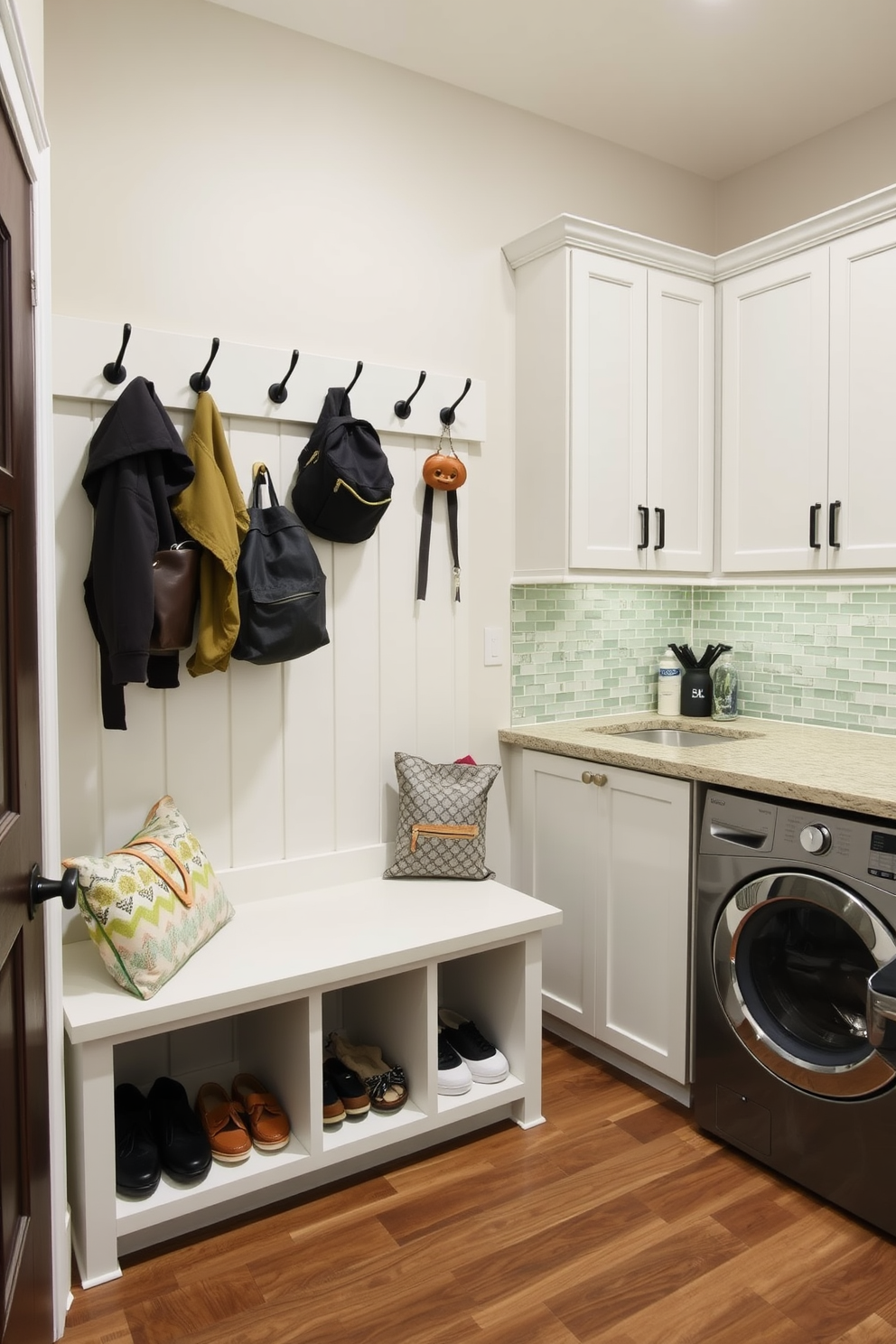 A functional drop zone for everyday items features a built-in bench with storage cubbies underneath for shoes and bags. The wall above is equipped with hooks for coats and backpacks, creating an organized and welcoming entryway. The large laundry room is designed with ample counter space for folding clothes and a deep sink for handwashing. Cabinets above provide storage for detergents and supplies, while a stylish backsplash adds a pop of color to the functional space.