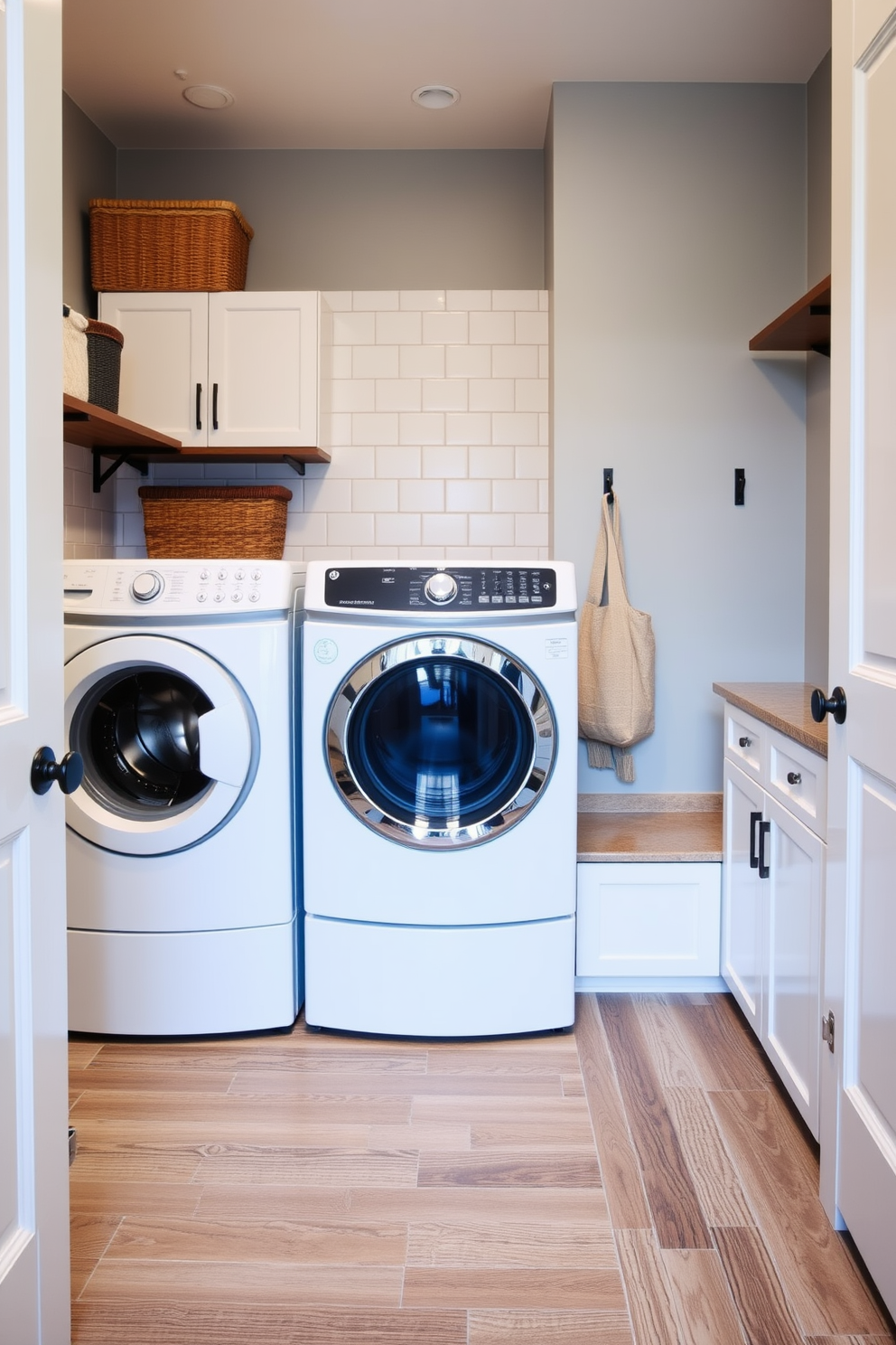 A functional laundry mudroom with durable flooring designed to withstand high traffic. The space features a combination of tile and luxury vinyl planks, providing easy maintenance and a stylish appearance.