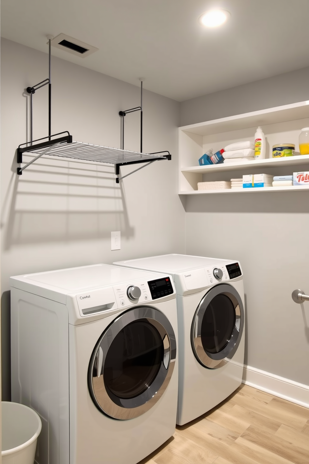 A cozy laundry room in the basement featuring colorful rugs that add warmth and texture to the space. The walls are painted in a soft gray, while the floor is tiled with large, light-colored ceramic tiles to enhance brightness. A spacious countertop for folding clothes is situated next to a modern washer and dryer set. Shelving above the countertop holds neatly organized baskets and decorative items, creating an inviting and functional atmosphere.