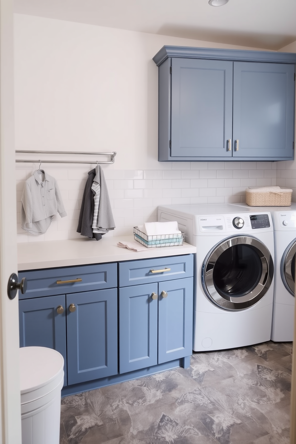 A functional mudroom laundry combo space features a spacious layout with built-in cabinetry for storage. The laundry appliances are seamlessly integrated into the cabinetry, with a countertop above for folding clothes and a stylish bench for sitting. Natural light floods the area through a large window, illuminating the soft gray walls and white trim. A durable tile floor in a herringbone pattern adds visual interest while being easy to clean.