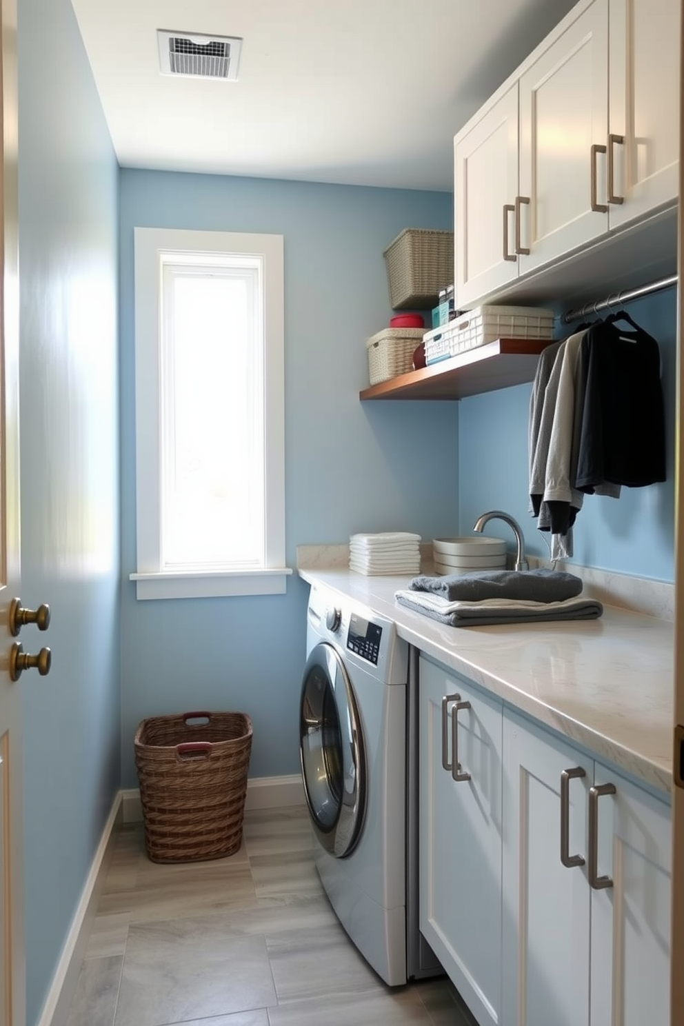 A functional laundry room designed for high traffic features durable flooring that can withstand heavy use. The space includes a top loading washer positioned next to a built-in countertop for folding clothes, with ample storage cabinets above.