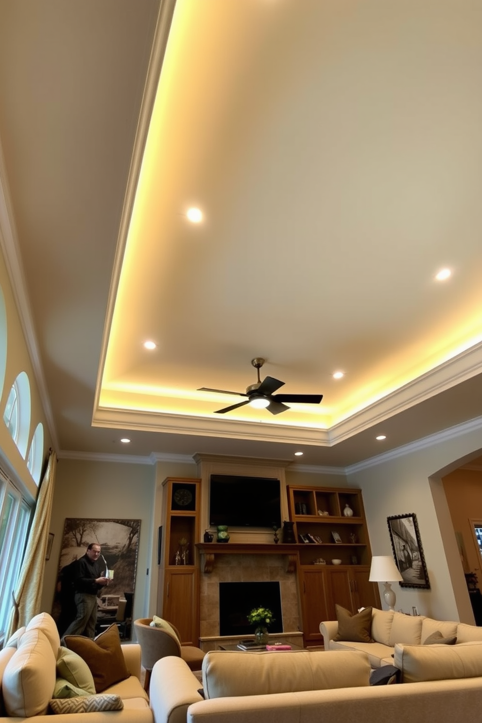 A spacious living room features a tray ceiling adorned with soft, ambient lighting that creates a warm and inviting atmosphere. The elegant design enhances the room's height, drawing the eye upward and adding a touch of sophistication. The ceiling is painted in a subtle shade that complements the walls, while the lighting fixtures are strategically placed to highlight architectural details. Plush furniture arranged below invites relaxation, making it the perfect space for gatherings and entertainment.