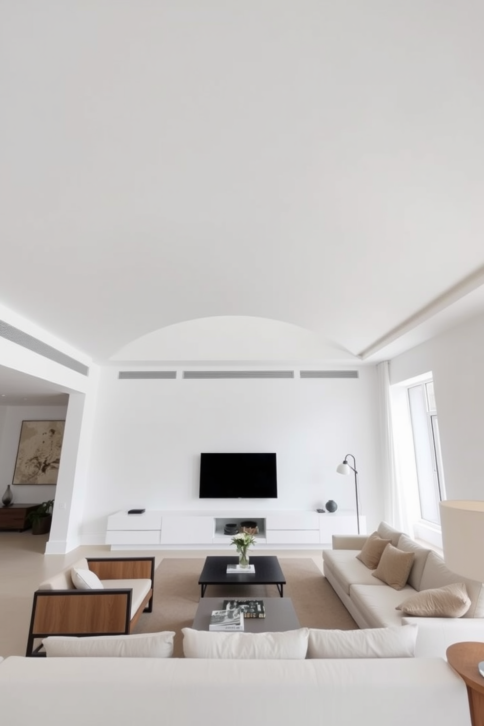 A minimalist living room featuring simple white ceilings that create an open and airy atmosphere. The walls are painted in soft neutral tones, and the space is adorned with sleek furniture pieces that emphasize clean lines and functionality.